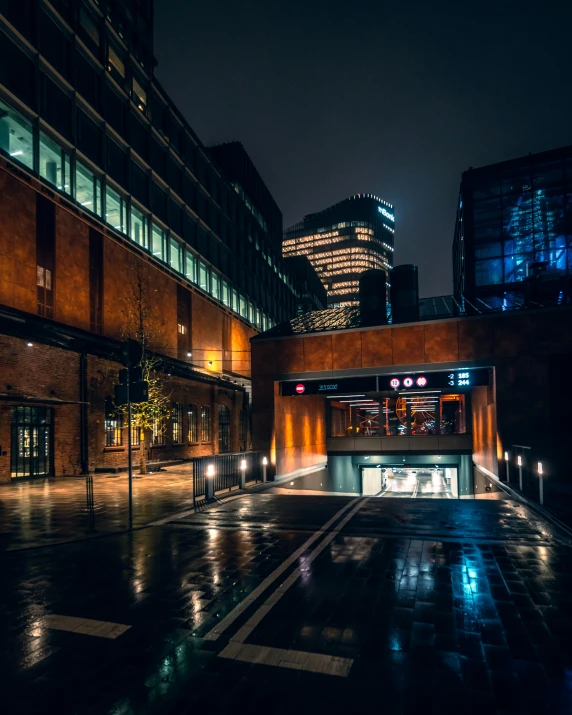 the entrance to a building on a wet night