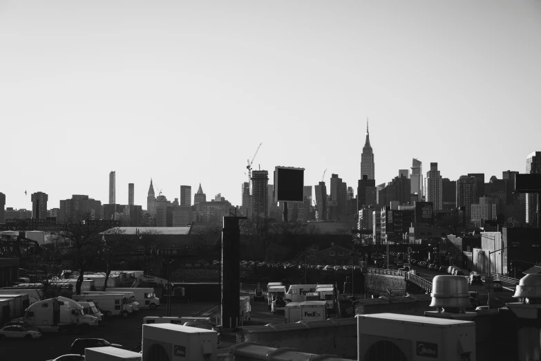 a large cityscape with cars parked in the lot