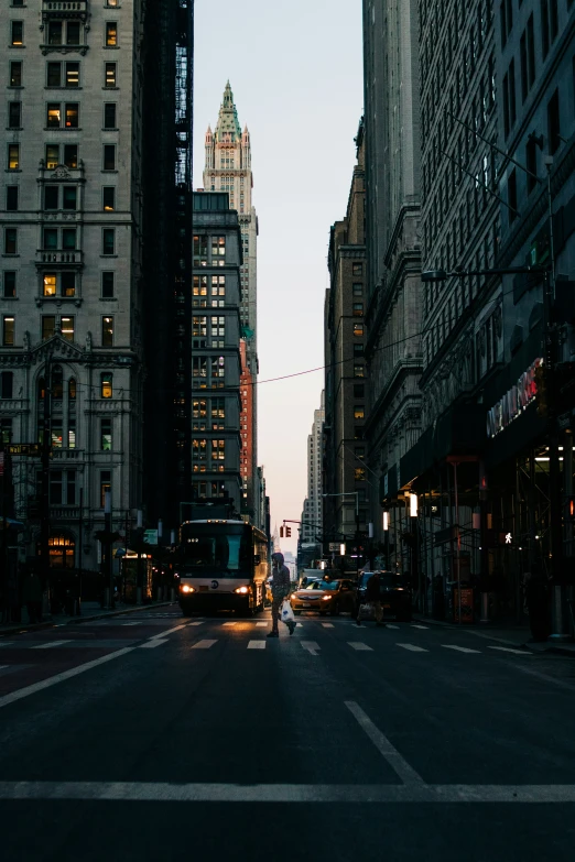 a very tall building surrounded by very few buildings