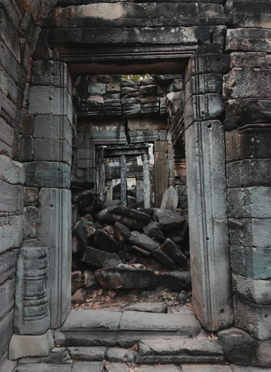 doorways in a complex surrounded by boulders and trees