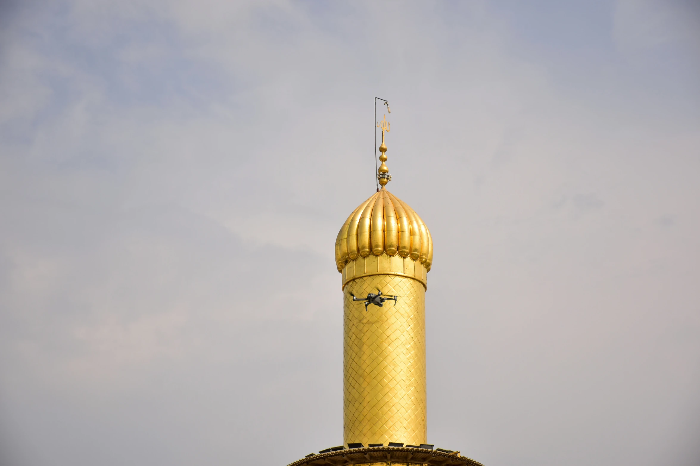 a golden building with a clock on top