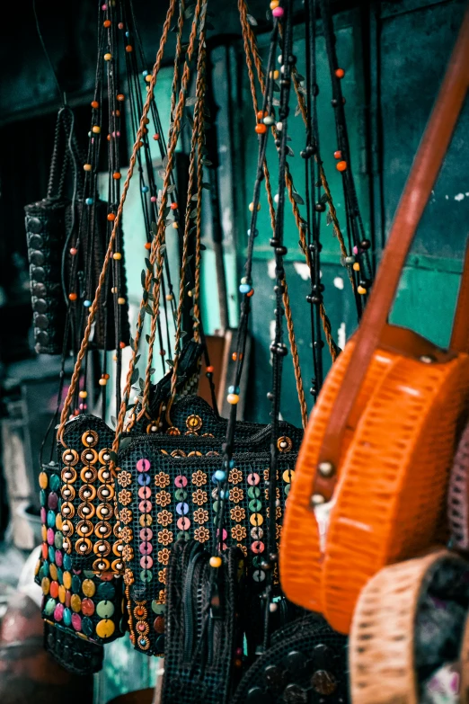 various purses hanging from the ceiling