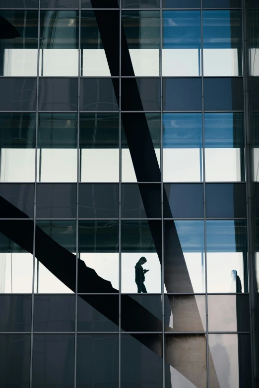 a window reflection of an abstract man standing