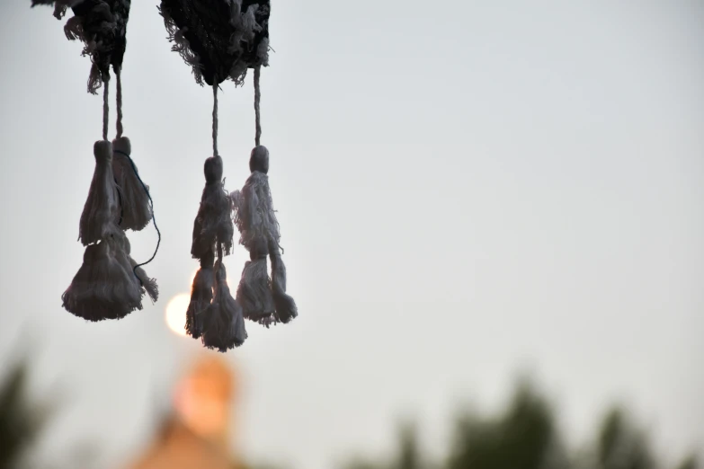 tassels hang from the ceiling in front of a building