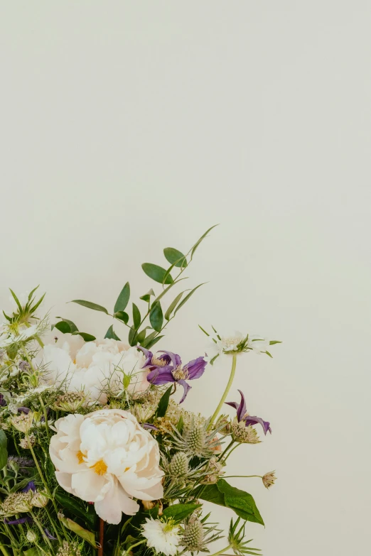 a vase full of flowers with white flowers on it