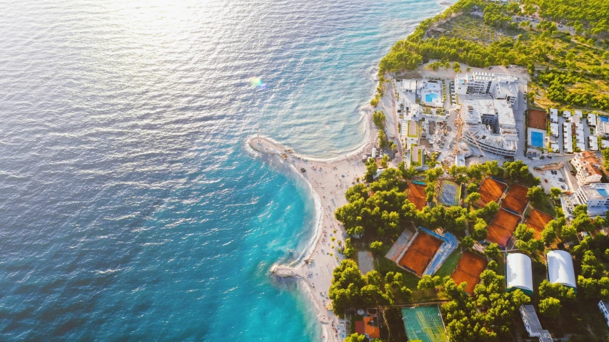 the aerial view of an ocean beach and resort