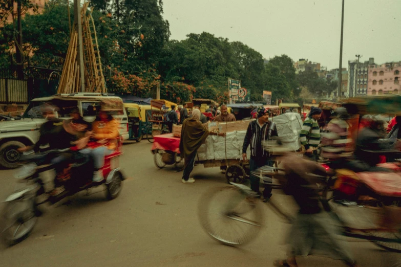 there is a lot of people walking and motorcycles