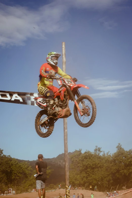 motorcyclist performing high jump on bike during race