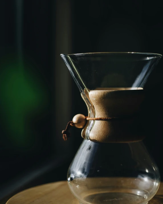 a decante glass cup filled with coffee on a table