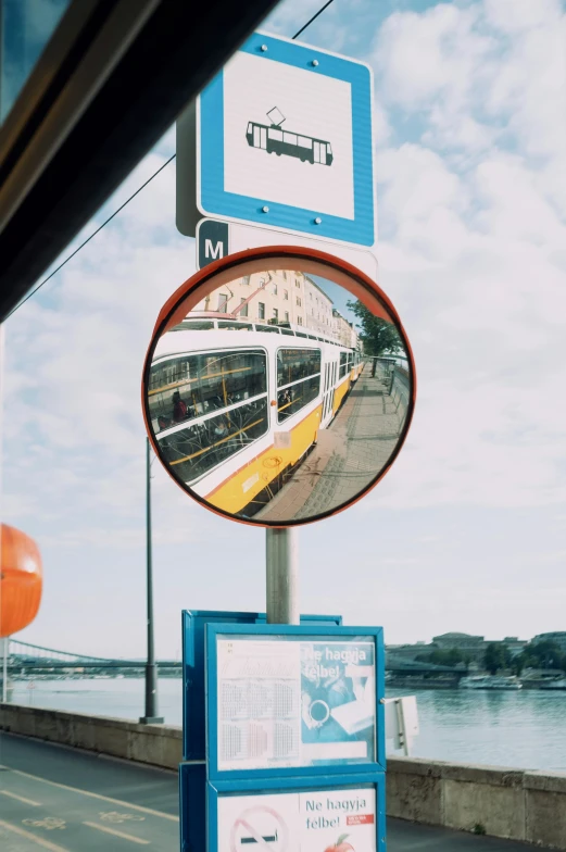 a train reflection is seen in a mirror