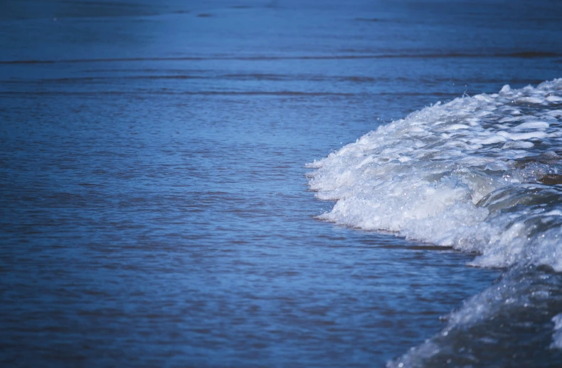 an ocean with waves coming in to the shore