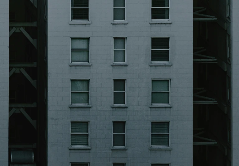 a building is white with many windows, and has no people