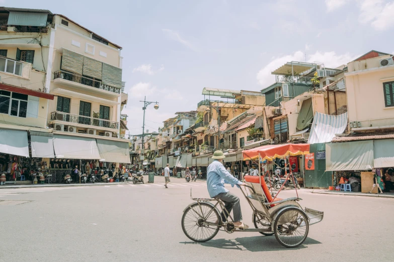 a person on a trike riding on the street