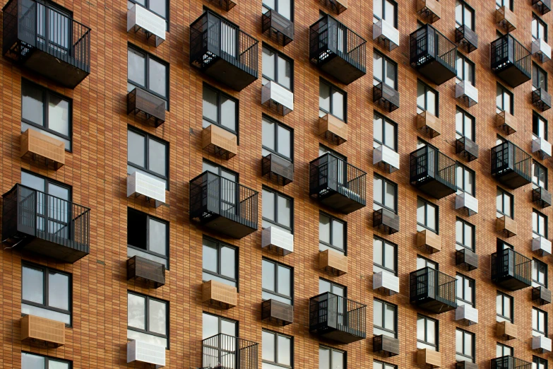 a very big red brick building with many windows