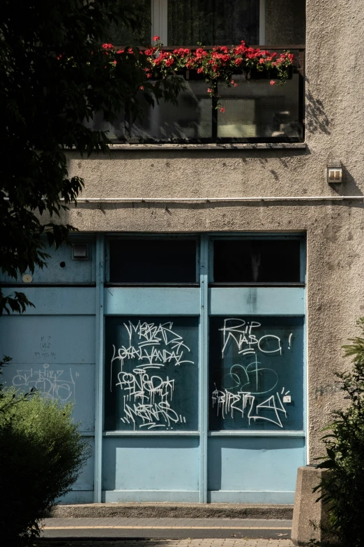 a graffiti covered building that has windows