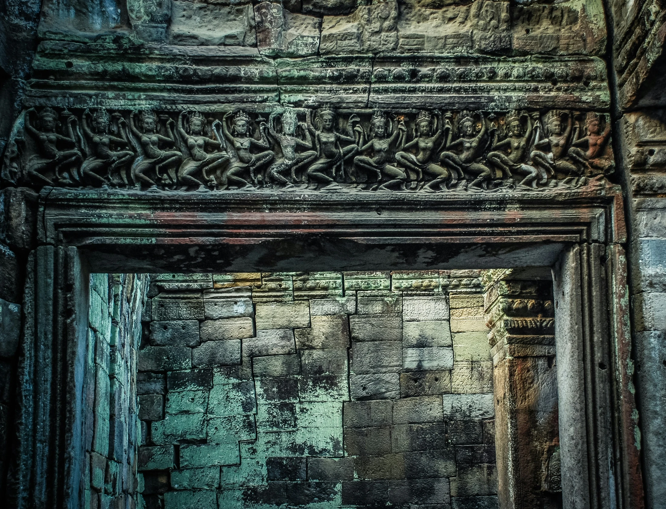 an old looking building with some carving on it