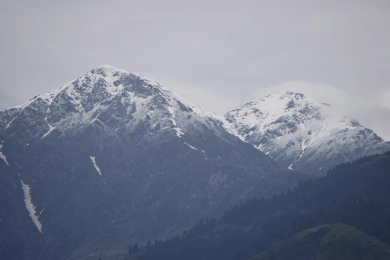 a very big mountain top with some snow