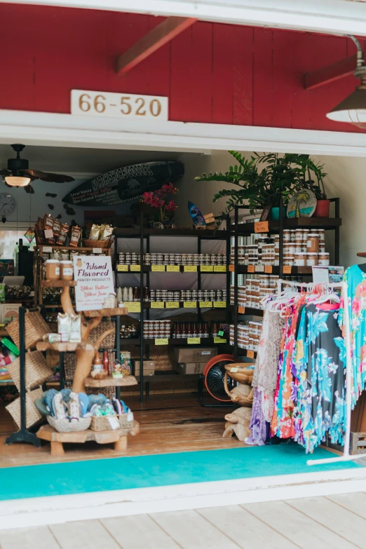 the front of a shop with various clothing and merchandise