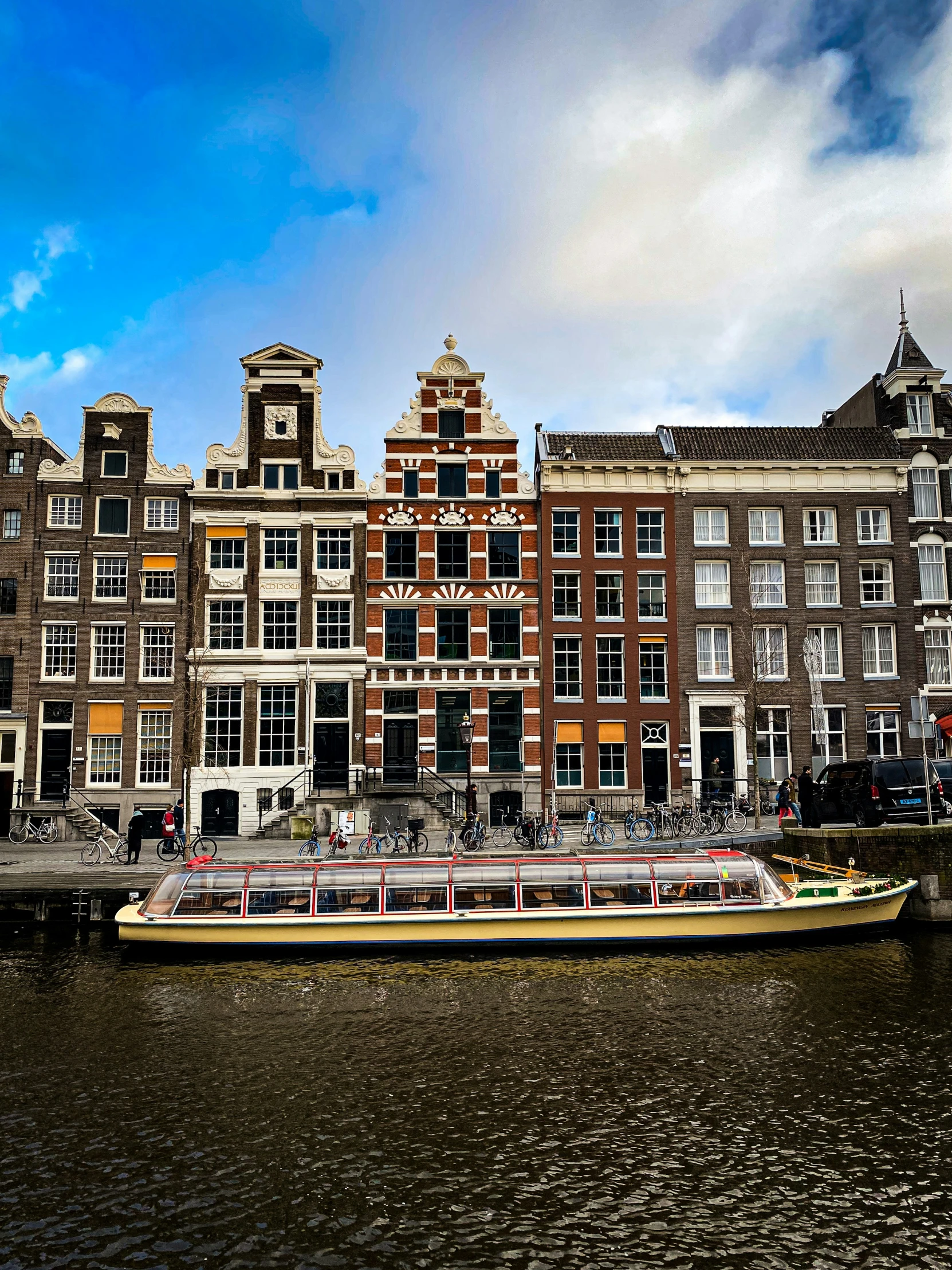 a large boat in the water near a city