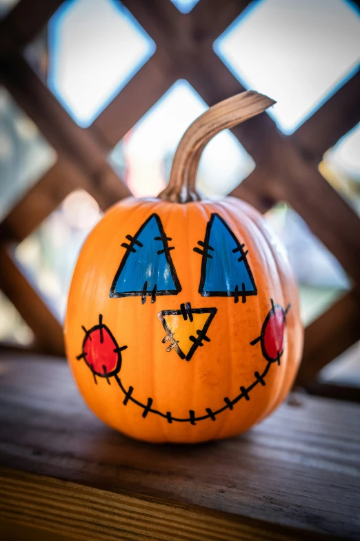 a jack - o'- lantern pumpkin decorated to look like an evil face