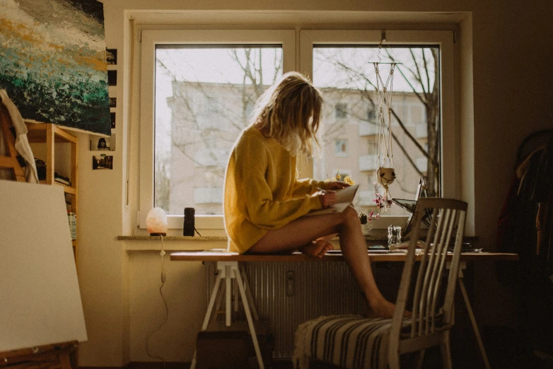 a person sitting in front of a window