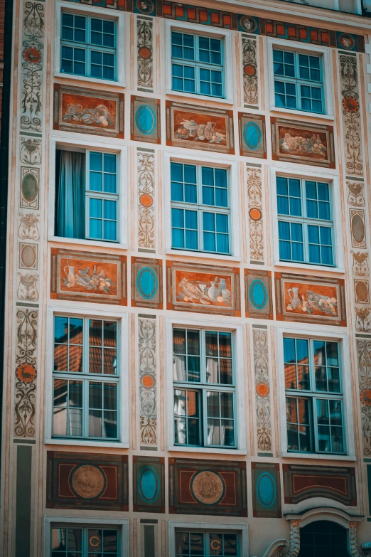 a very unique building in the city with many windows