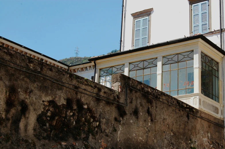 a big white building with some windows in front of it