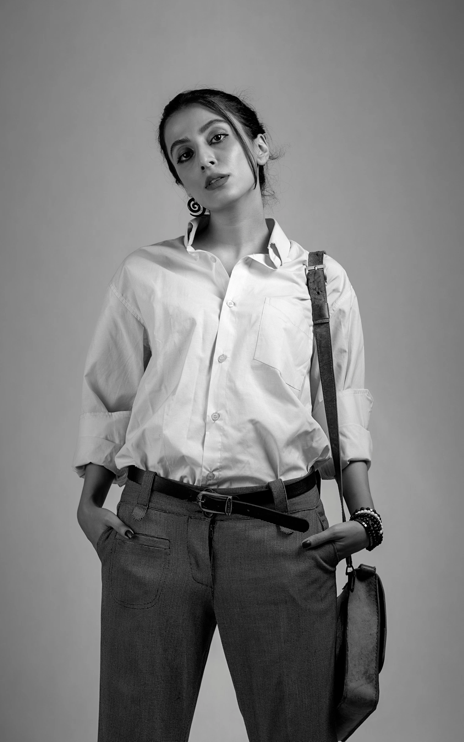 a woman is wearing suspenders and a shirt