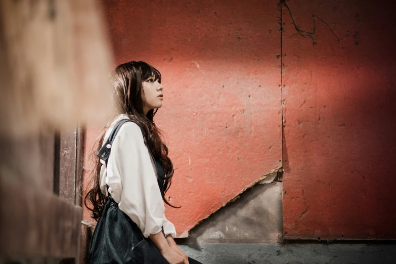 a woman walking down some stairs with a back pack