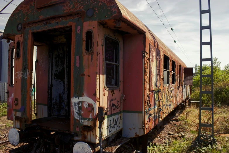 an old abandoned train car on the tracks