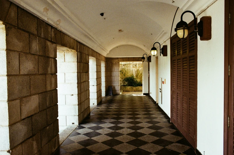 a walkway with a large checkered tile floor