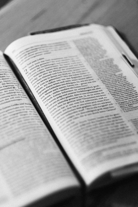 a open book lying on top of a table