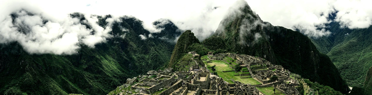 the most famous tourist area in peru has a massive area with a long, pyramid shaped rock face