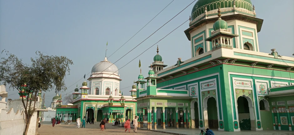 the streets surrounding this colorful colored city have tall structures