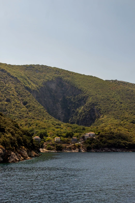 the waters and hills are very mountainous and there is a house built on top