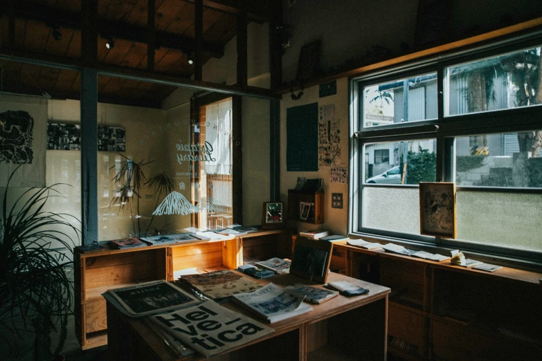 a dark room with a table and books on it