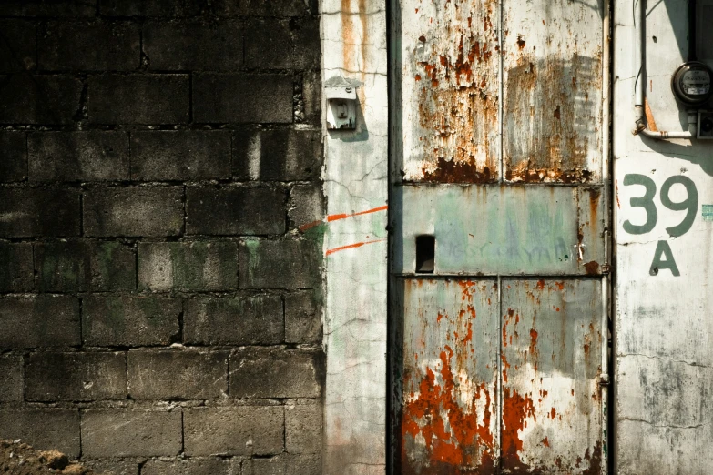 old and peeling rusted door on a building