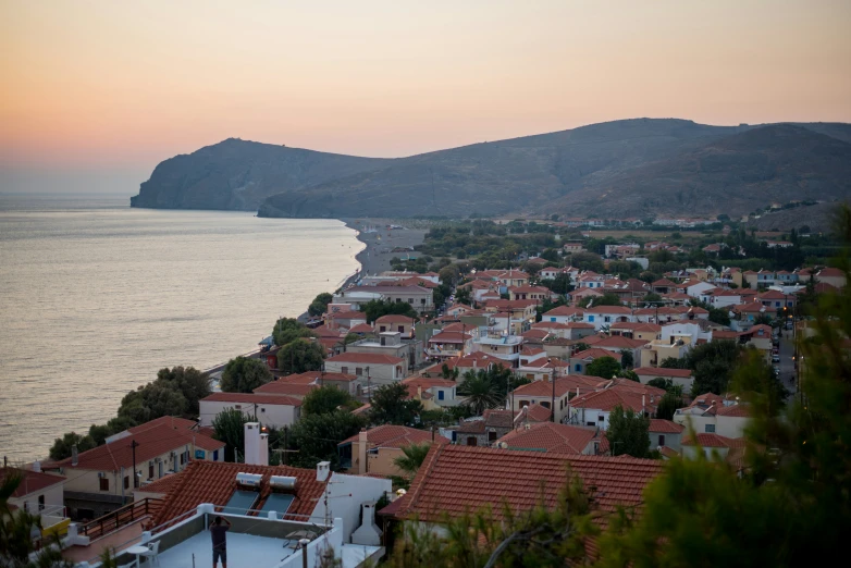 a view of some houses that are next to a body of water