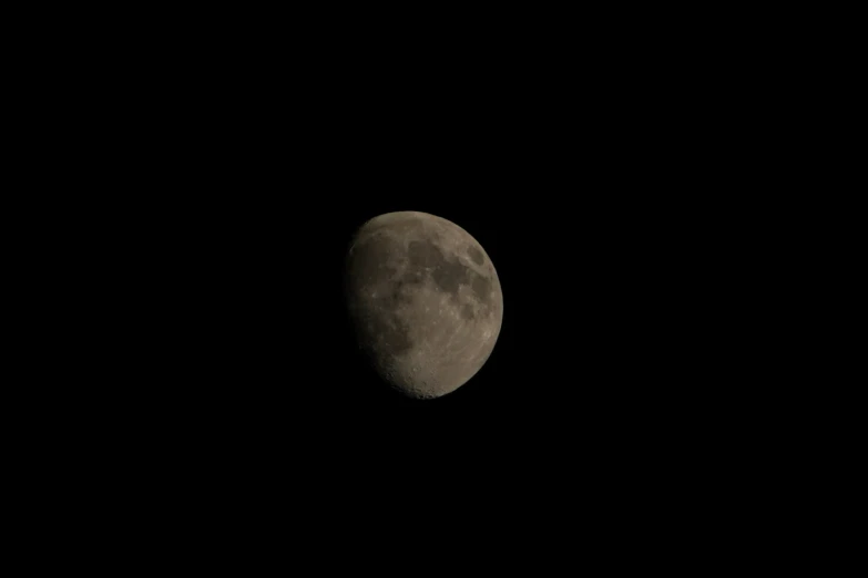 the moon in the night sky is seen with its light from the telescope