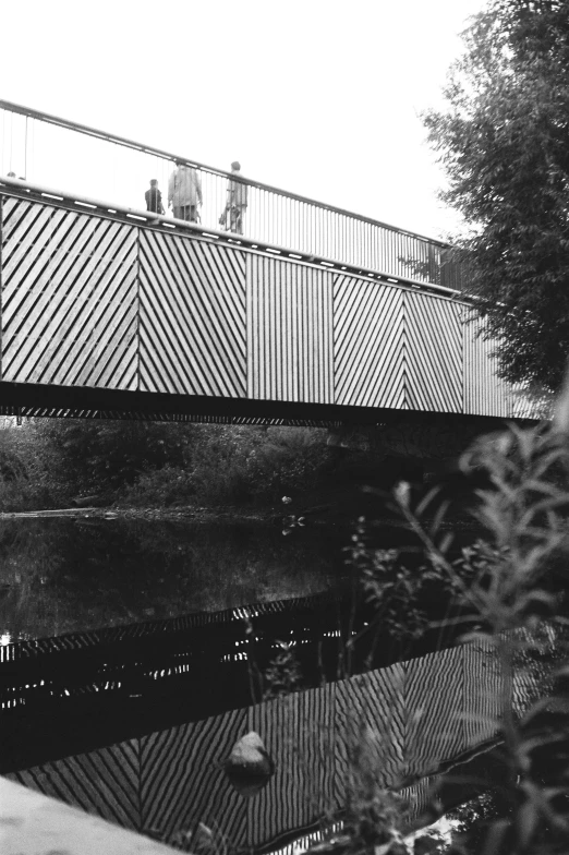 black and white pograph of a pedestrian bridge
