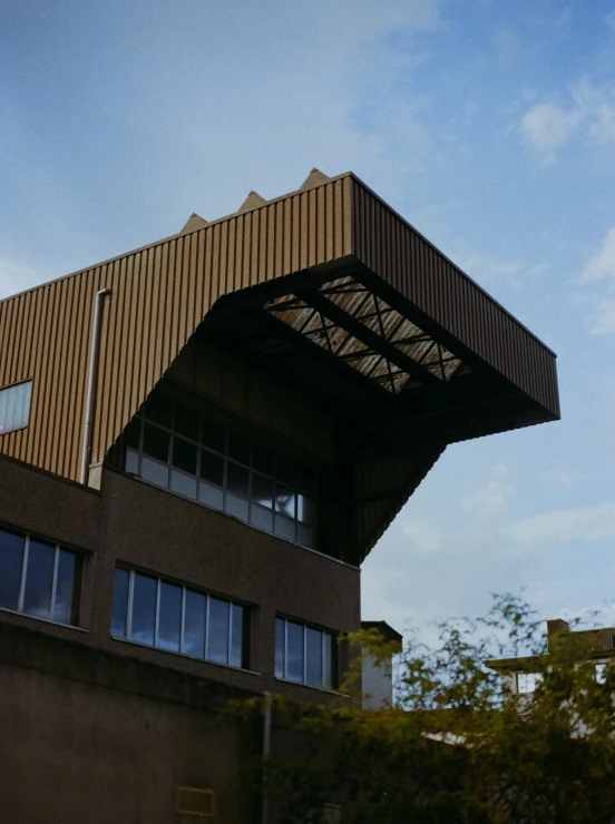 an upside down clock tower is next to a building