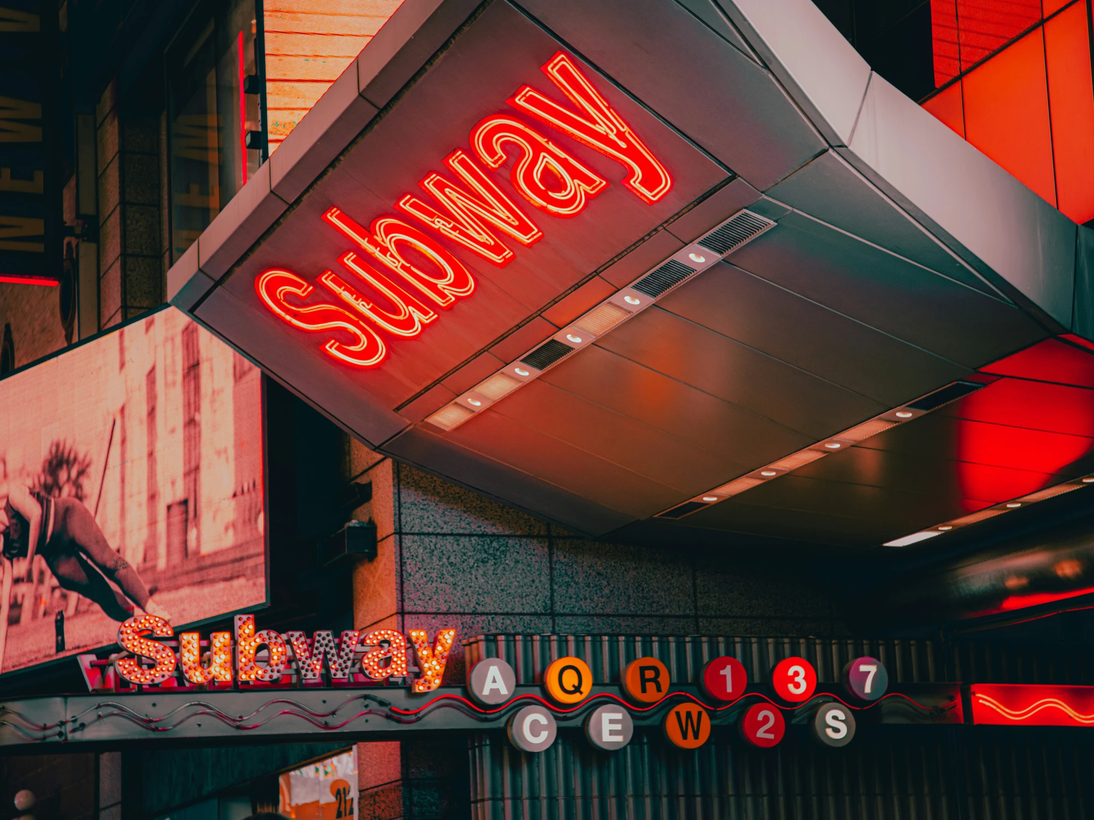 red and yellow signs on a building near an asian restaurant