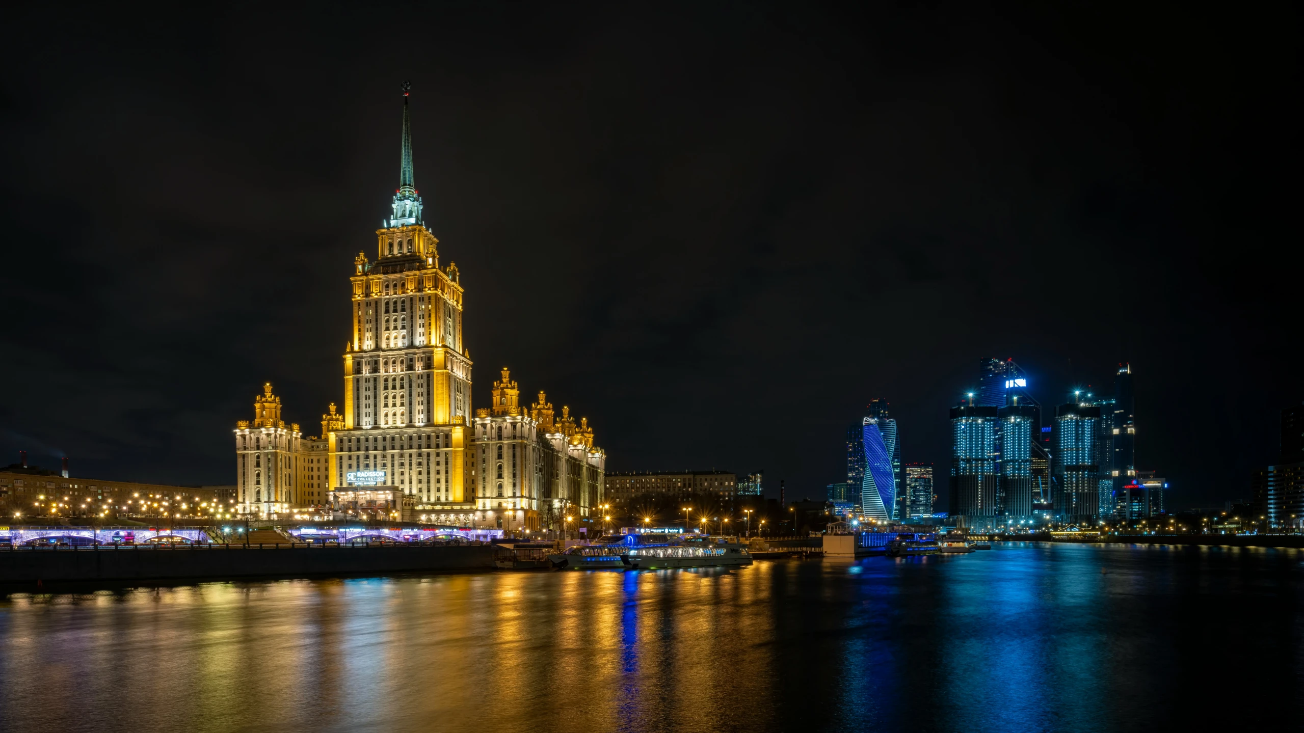 a tall clock tower towering over a city filled with buildings