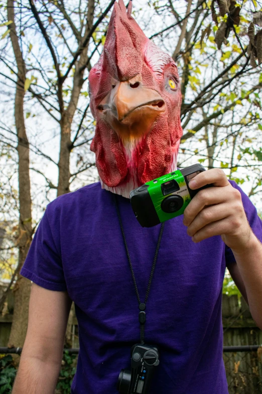 a person with an animal mask taking a po