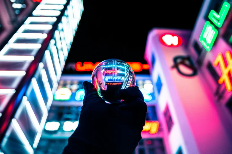 a person holding up a crystal ball