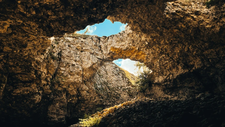 an open window in the side of a cave