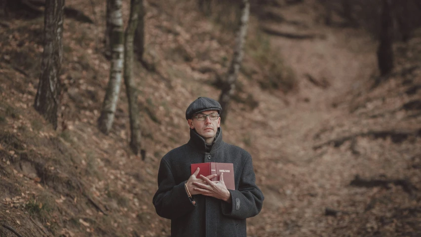 a person with a book is on a trail