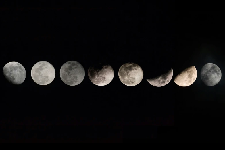 a row of different kinds of moon in the sky