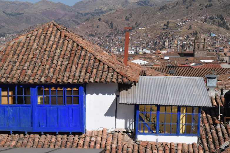 colorful rooftops in an old city with a blue door