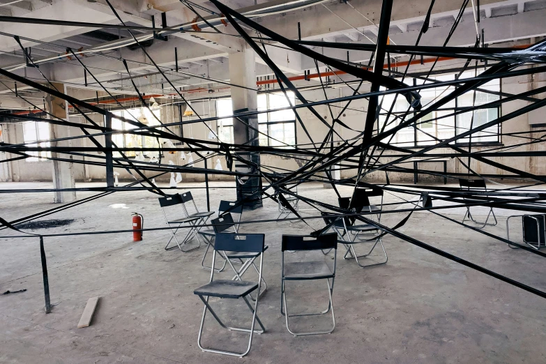 a room with chairs and wires in it